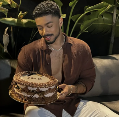 Community member holding a cake