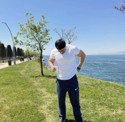 Community member outdoors near the water